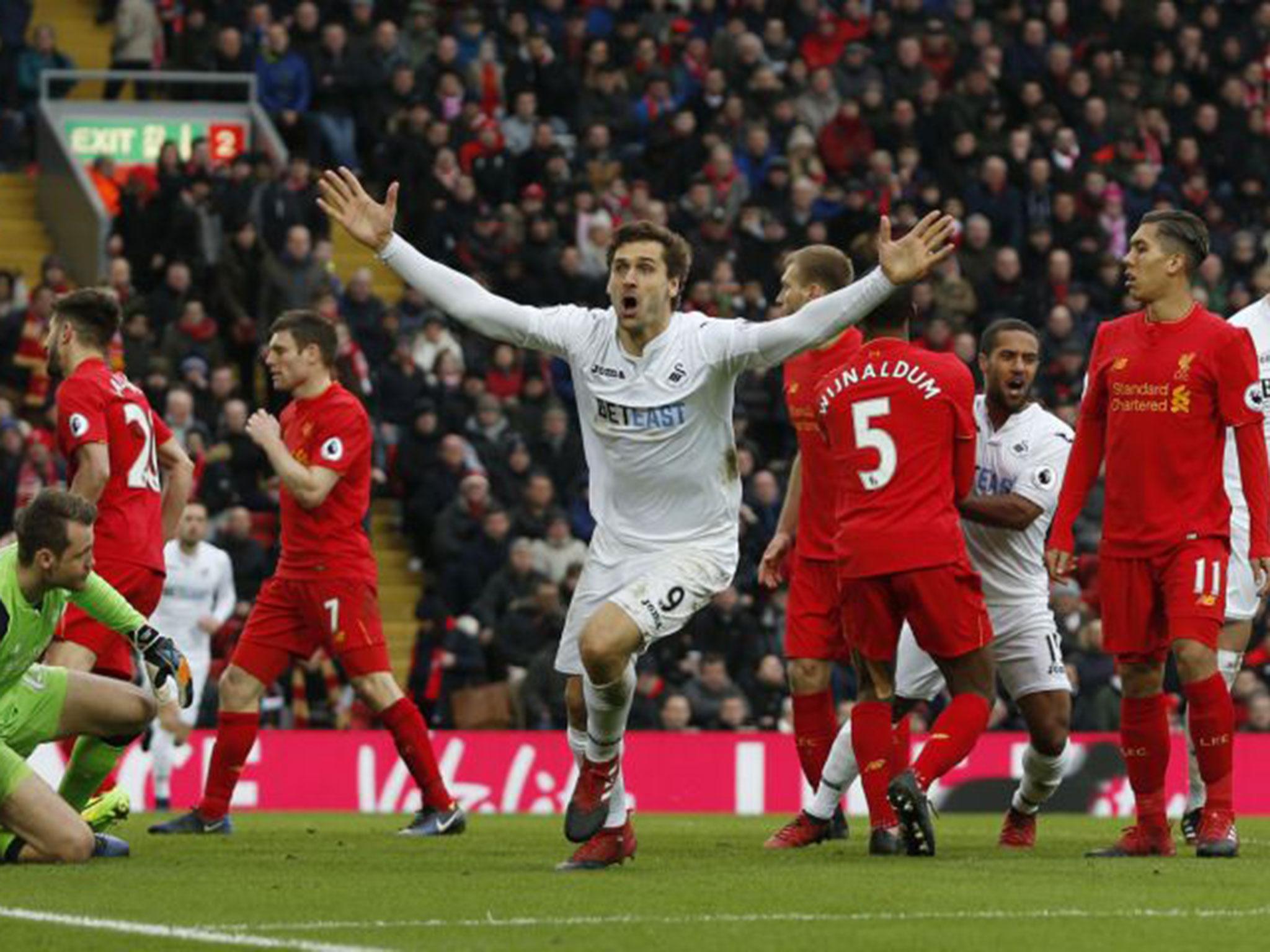 Fernando Llorente celebrates scoring the first goal for Swansea against Liverpool