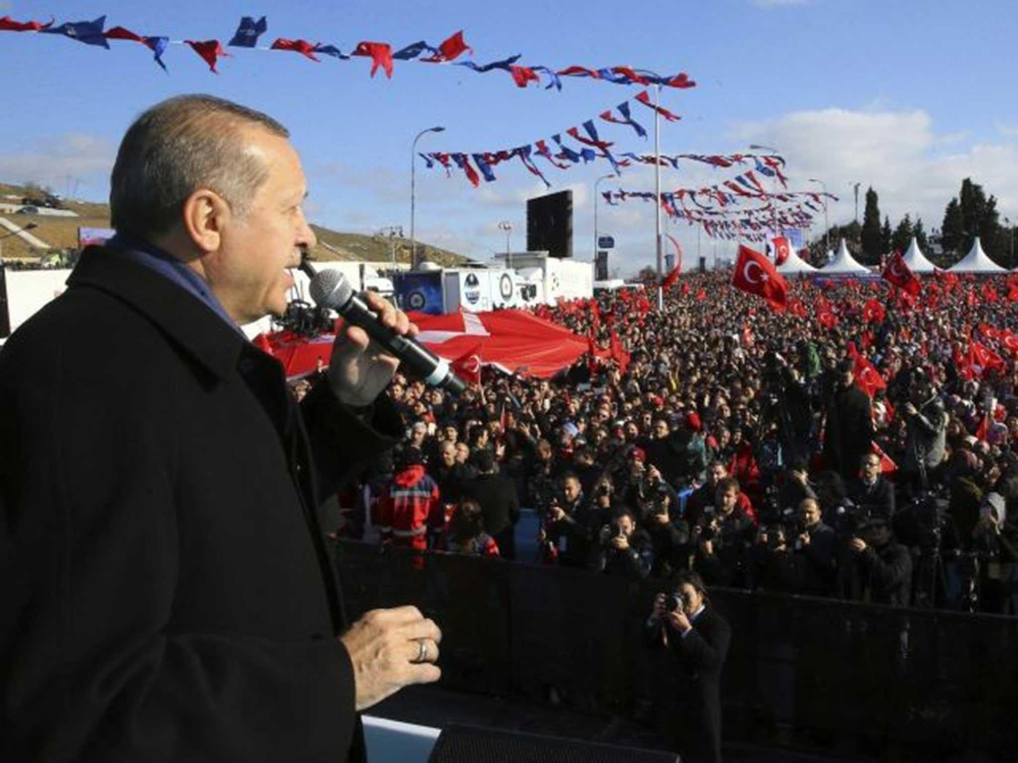 President Erdogan addresses supporters in Istanbul just before a round of voting on the proposed constitutional reforms in Ankara's parliament AP