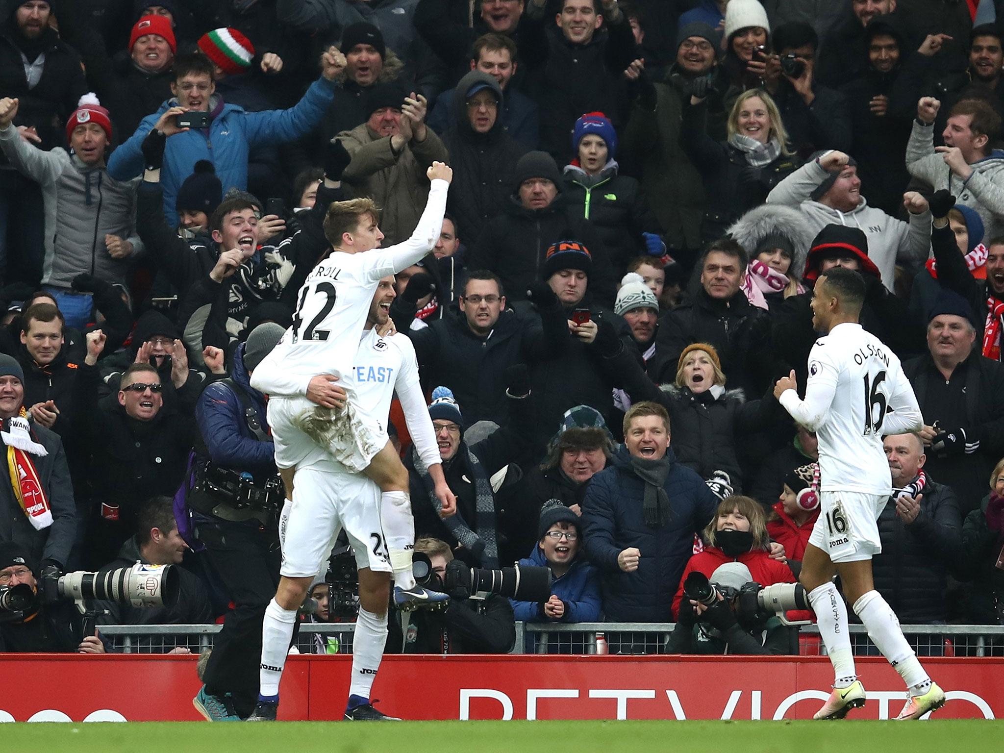 Gylfi Sigurdsson celebrates after scoring Swansea's winning goal against Liverpool