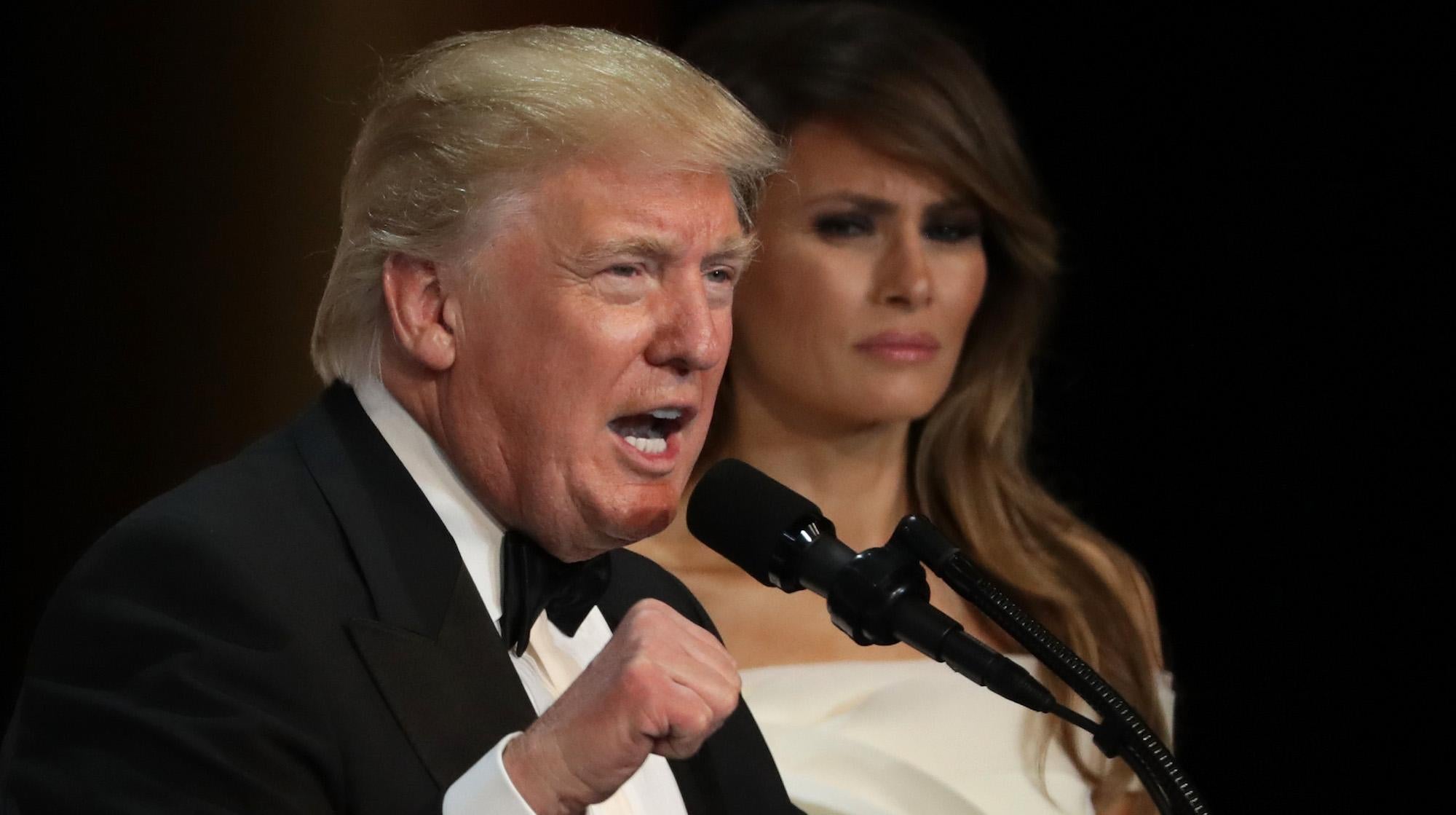 Donald Trump speaks as his wife First Lady Melania Trump looks on during A Salute To Our Armed Services Inaugural Ball at the National Building Museum on January 20, 2017 in Washington.