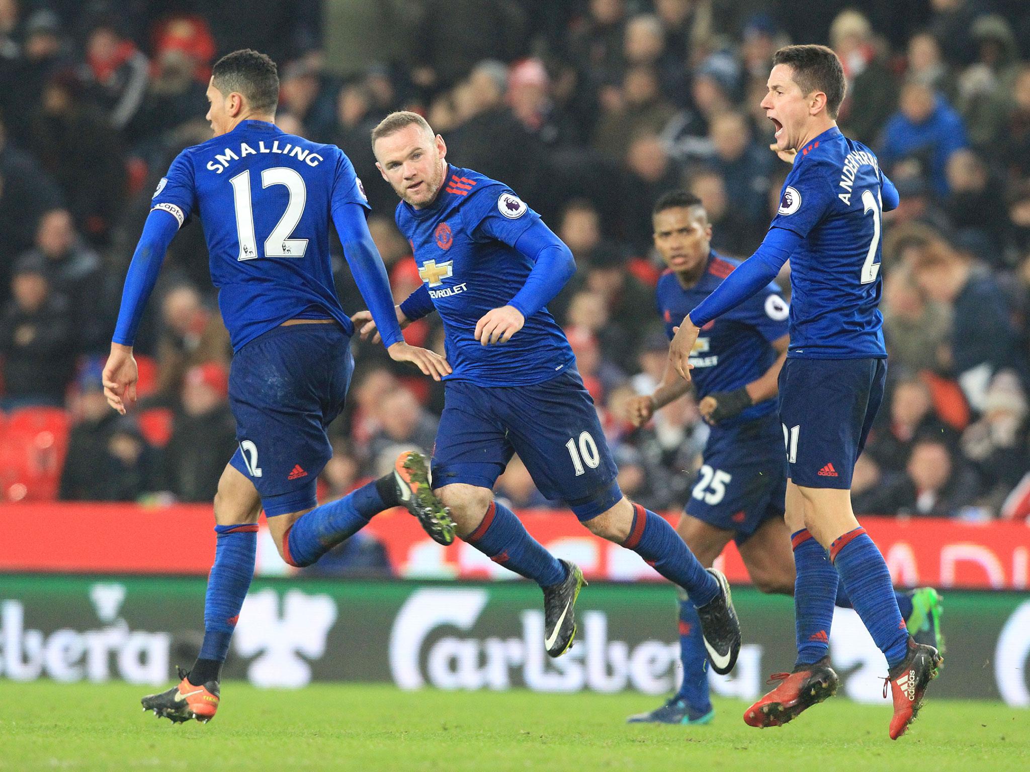 Wayne Rooney celebrates scoring his club-record 250th goal for Manchester United