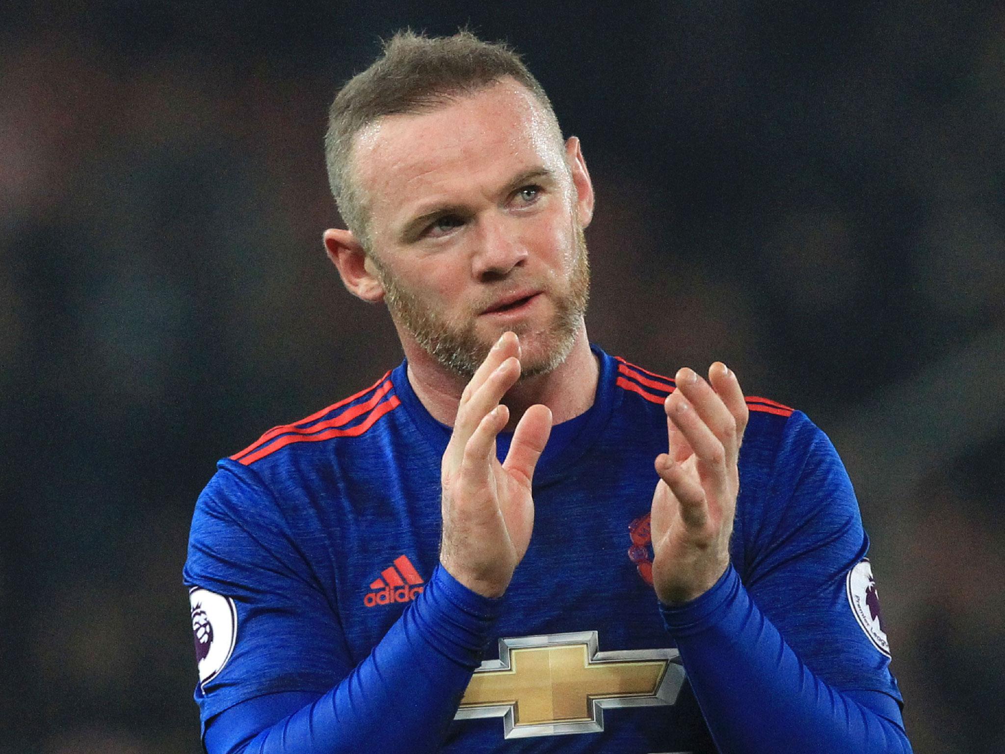 Wayne Rooney applauds the Manchester United fans after his record-breaking 250th goal
