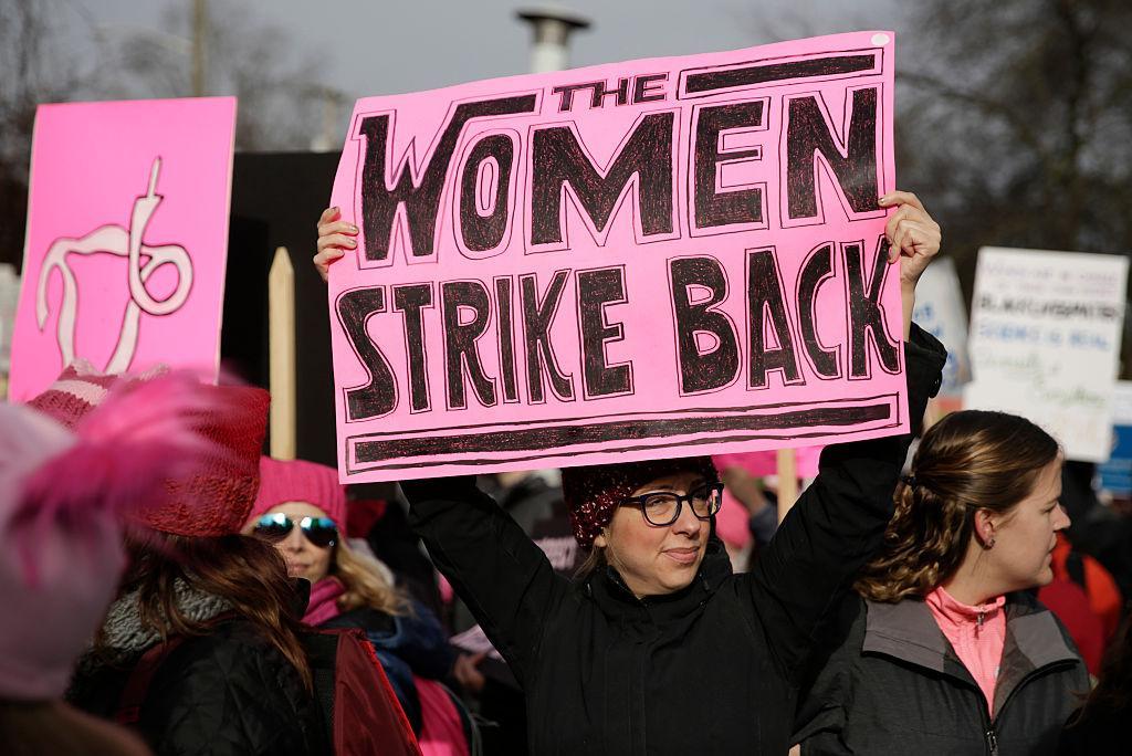 People gather at Judkins Park during the Women's March in Seattle, Washington on January 21, 2017. Led by women in pink "pussyhats," hundreds of thousands of people packed the streets of Washington and other cities Saturday in a massive outpouring of defiant opposition to America's hardline new president, Donald Trump.