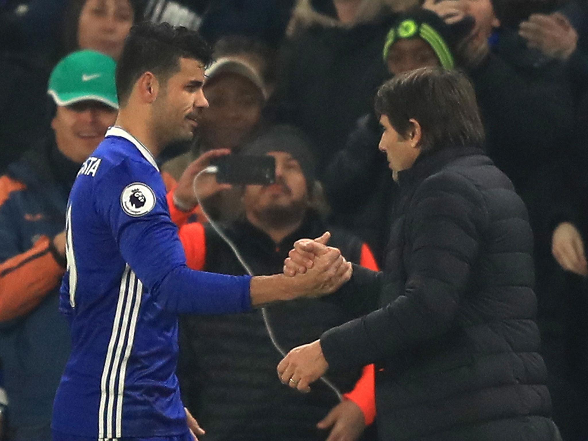 Diego Costa shakes hands with Antonio Conte after being replaced in the second-half