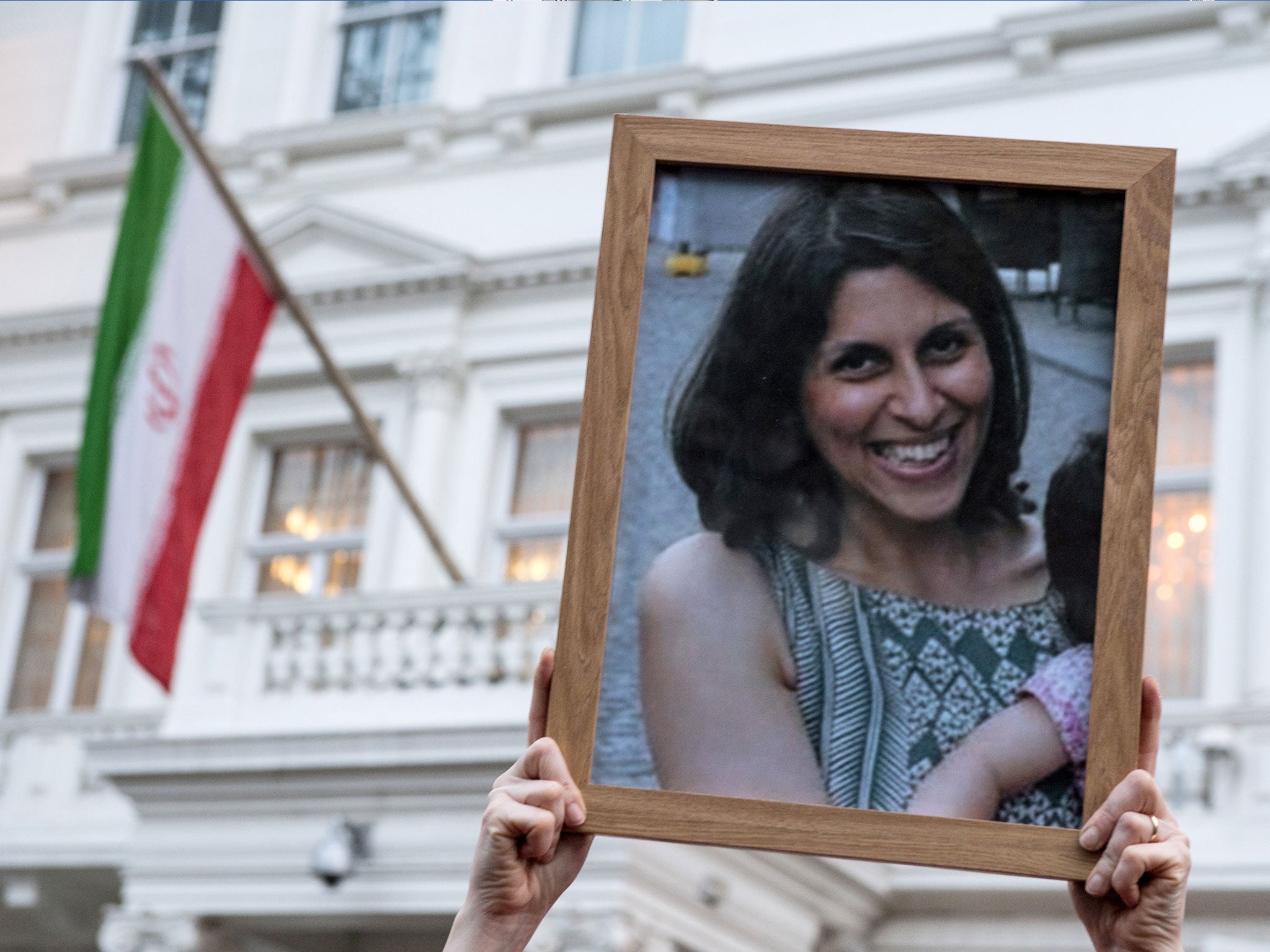 Supporters hold a photo of Nazanin Zaghari-Ratcliffe during a vigil