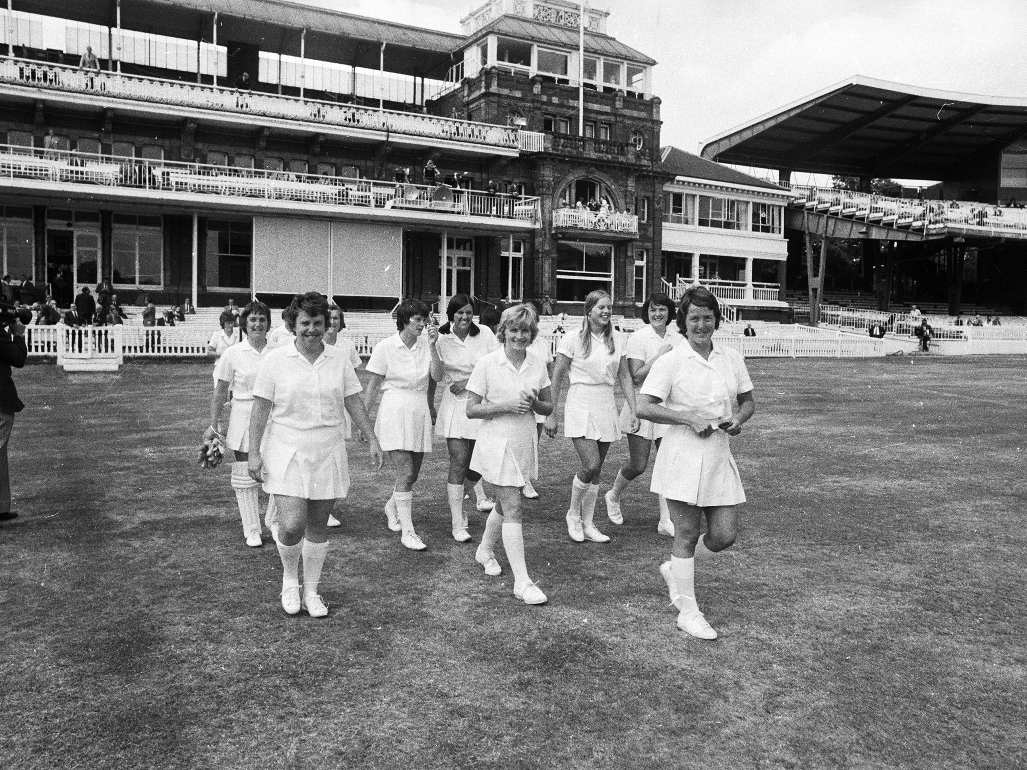 Rachel Heyhoe-Flint, the captain of the English Women's cricket team leads her team onto the pitch for the first ever women's cricket match to be played at Lord's