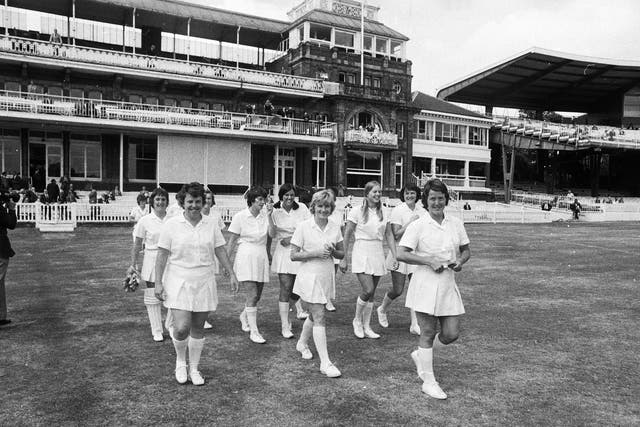 Rachel Heyhoe-Flint, the captain of the English Women's cricket team leads her team onto the pitch for the first ever women's cricket match to be played at Lord's