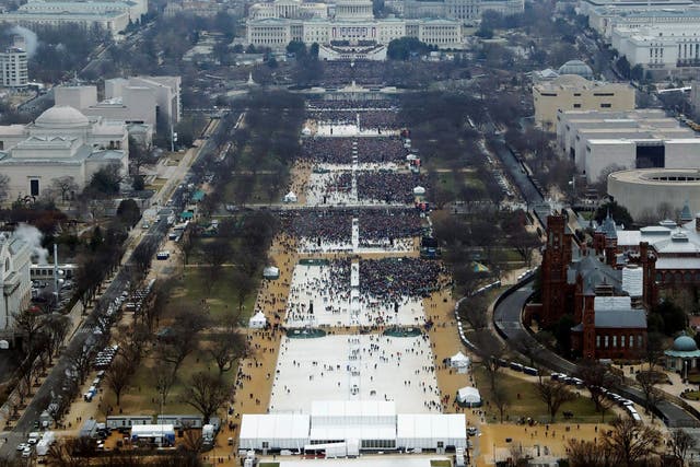 Crowds attending the inauguration ceremonies to swear in U.S. President Donald Trump at 12:01pm (L) on January 20, 2017 a