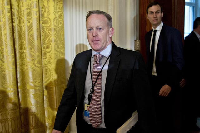 Sean Spicer, White House press secretary, arrives to a swearing in ceremony of White House senior staff in the East Room of the White House on January 22, 2017 in Washington, DC