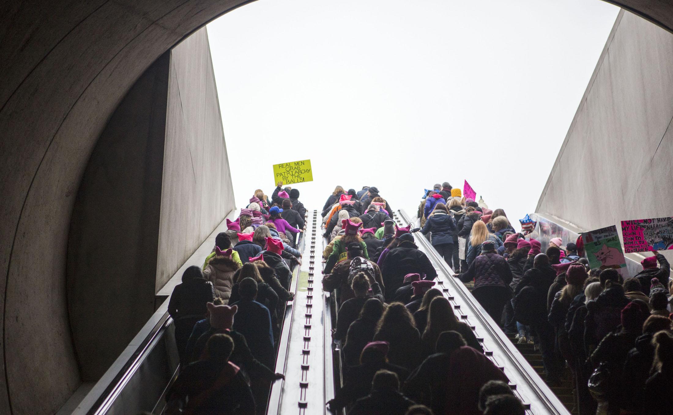 Protesters arrive at the Capital South Metro station for the Women's March on Washington on January 21, 2017 in Washington, DC. Following the inauguration of Donald Trump as the 45th president of the United States, the Women's March has spread to be a global march calling on all concerned citizens to stand up for equality, diversity and inclusion and for women's rights to be recognised around the world as human rights.