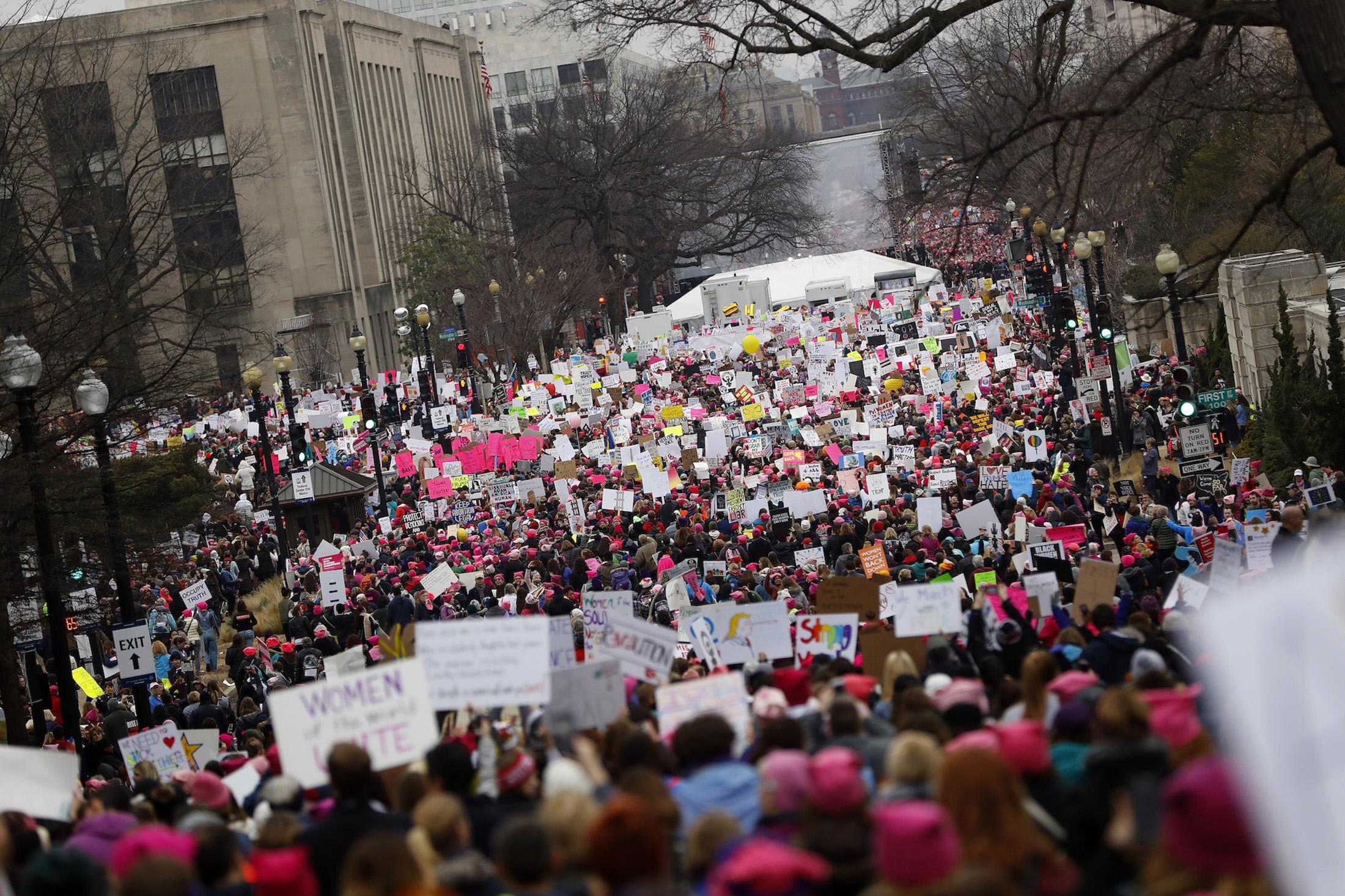 Protesters gather during the Women's March on Washington January 21, 2017 in Washington, DC. The march is expected to draw thousands from across the country to protest newly inaugurated President Donald Trump.