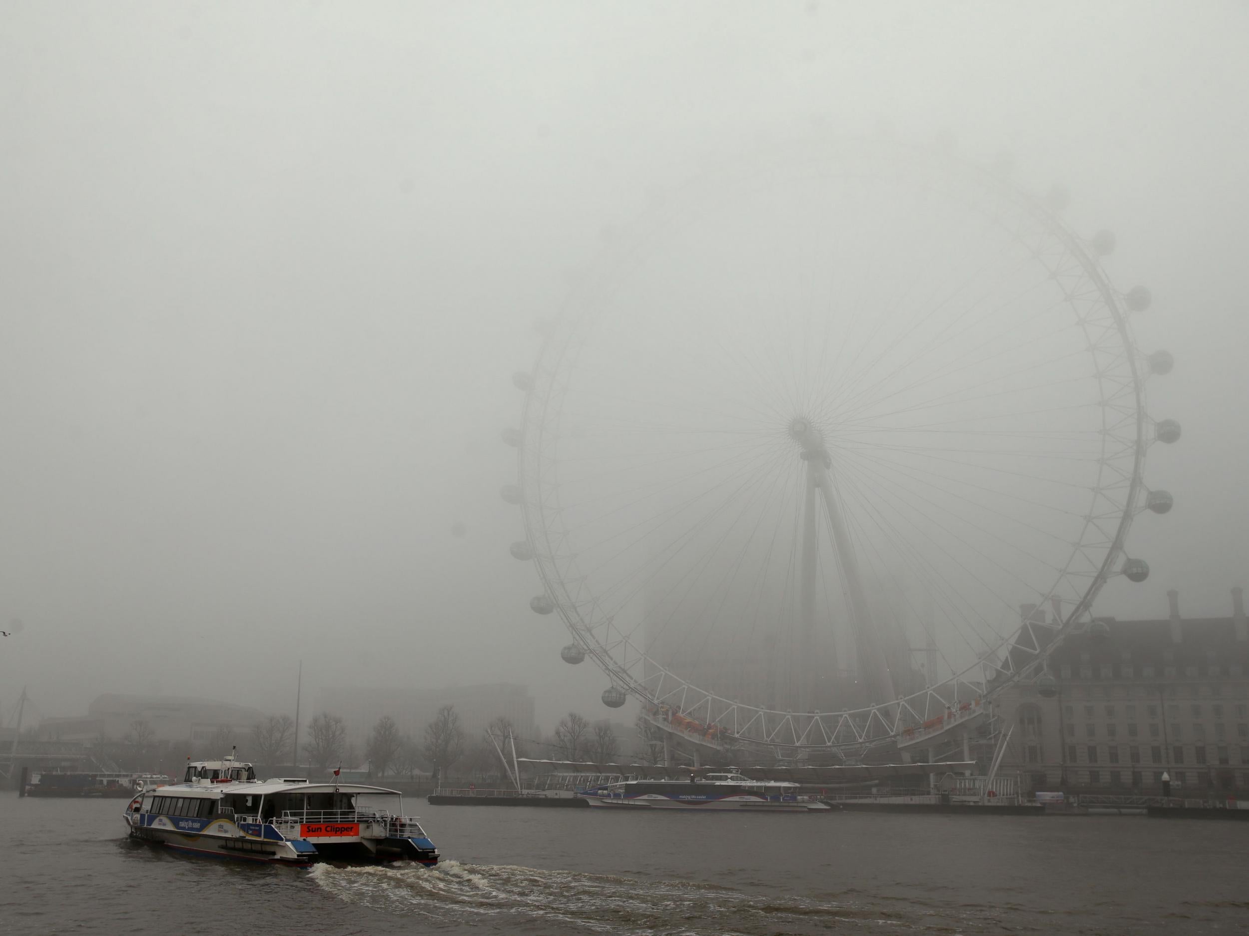 Dense fog shrouds the London Eye in central London on Monday 23 January