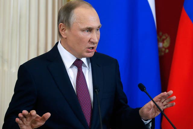 Russian President Vladimir Putin gestures as he speaks at the Kremlin in Moscow on January 17, 2017