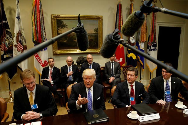 U.S. President Donald Trump hosts a meeting with business leaders in the Roosevelt Room of the White House in Washington January 23, 2017. From left are Corning CEO Wendell Weeks, Trump, Johnson & Johnson CEO Alex Gorsky and Dell CEO Michael Dell