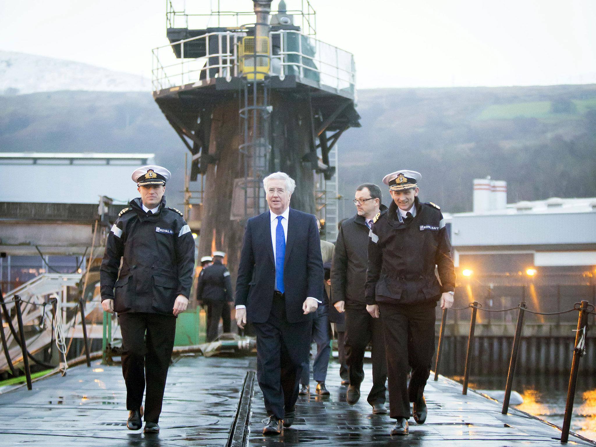 Sir Michael Fallon on board the HMS Vigilant in Clyde. The submarine is one of four vessels carrying the Trident nuclear system