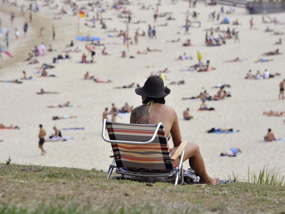 People cool off at Coogee Beach as temperatures soar across the city of Sydney