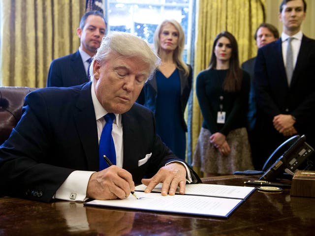 Trump signs executive orders in the White House Oval Office