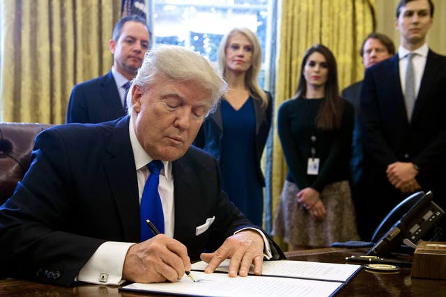 Trump signs executive orders in the White House Oval Office