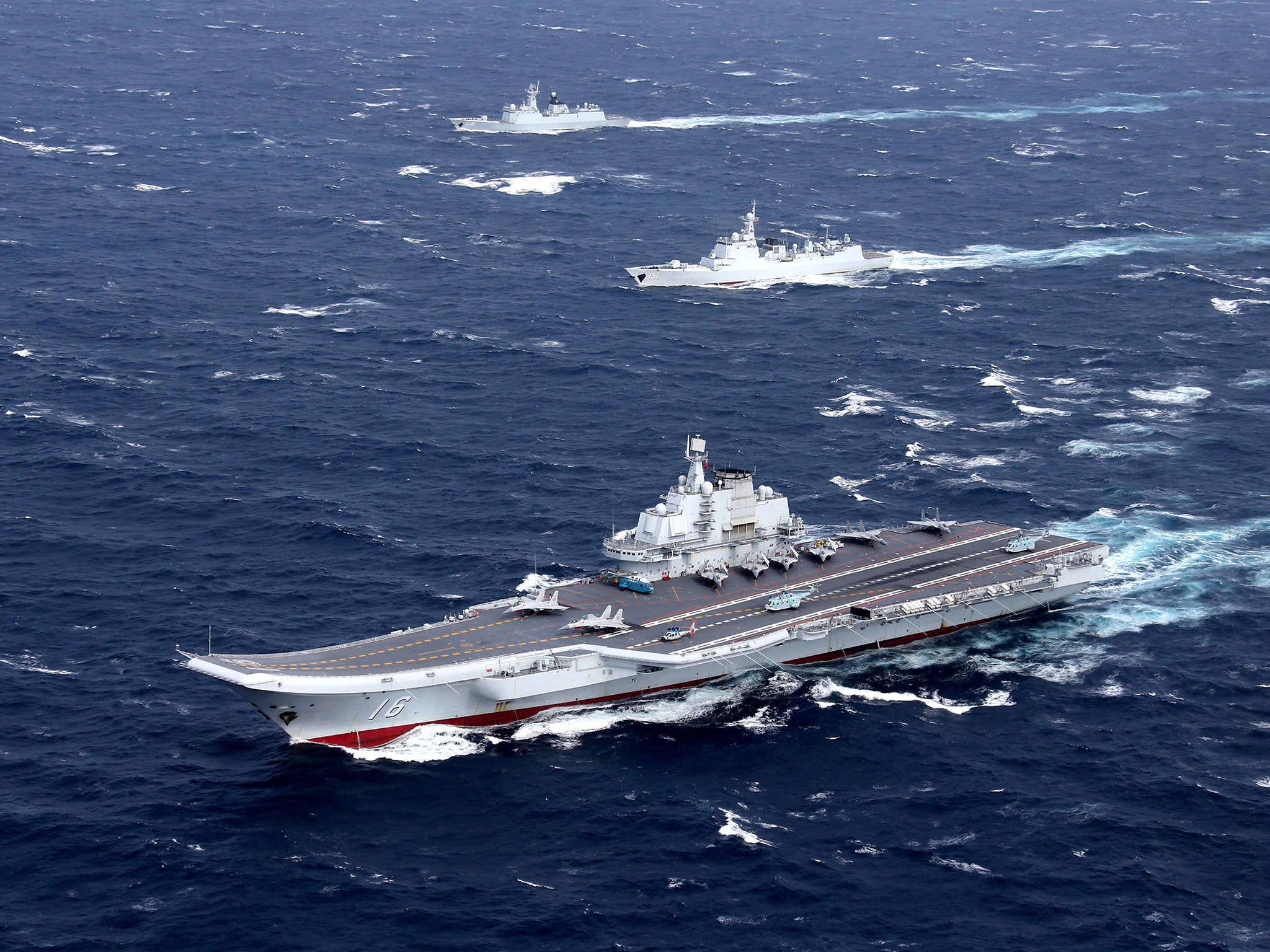 China's Liaoning aircraft carrier with accompanying fleet conducts a drill in the South China Sea
