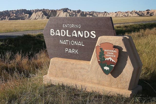 Visitors drive into the Badlands National Park on October 1, 2013 near Wall, South Dakota.