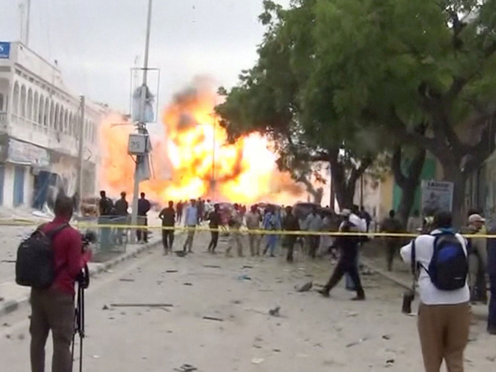 A still from a Reuters TV video shows a secondary explosion after a suspected suicide car bomb rammed into the gates of a hotel in Mogadishu, Somalia 25 January, 2017