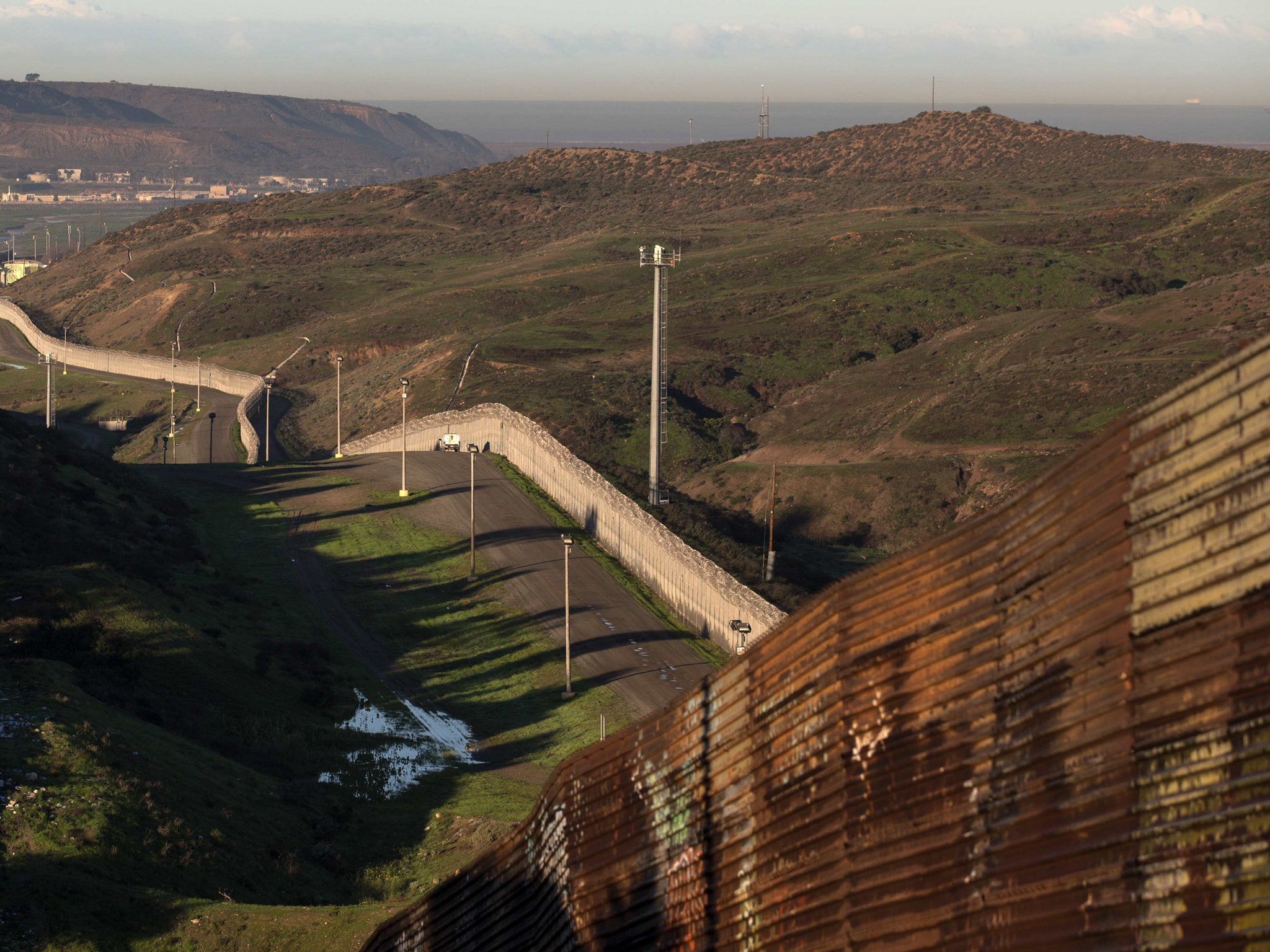 A portion of wall that already exists along the Mexico-California border