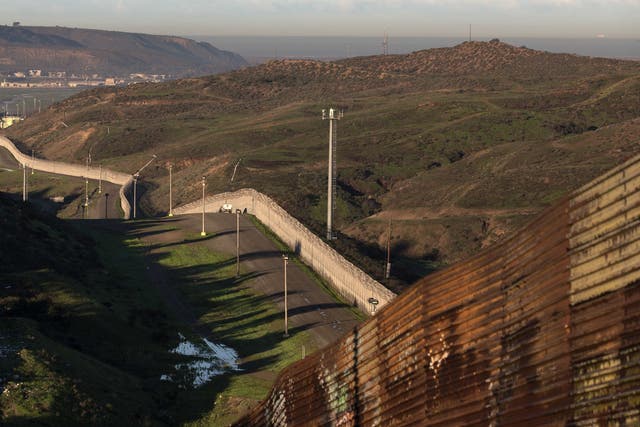 A portion of wall that already exists along the Mexico-California border