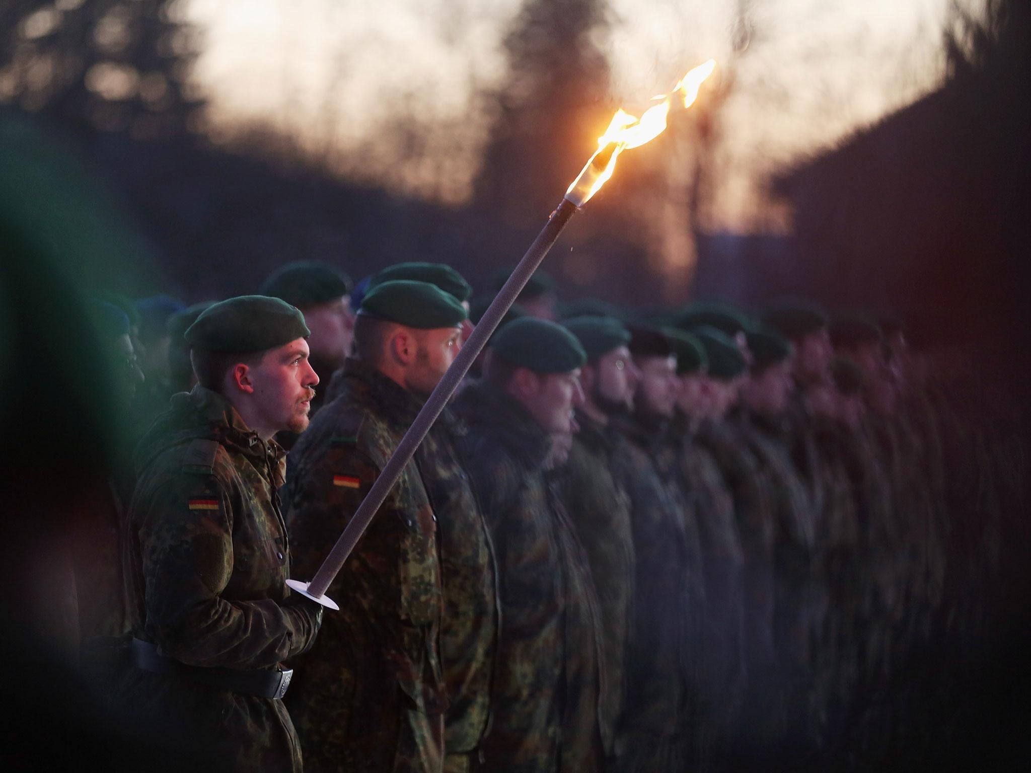 Soldiers of armored infantry battalion Panzergrenadierbataillon 122 of the Bundeswehr, the German armed forces, attend a ceremony to mark their pending deployment to Lithuania on 19 January, 2017 in Oberviechtach, Germany