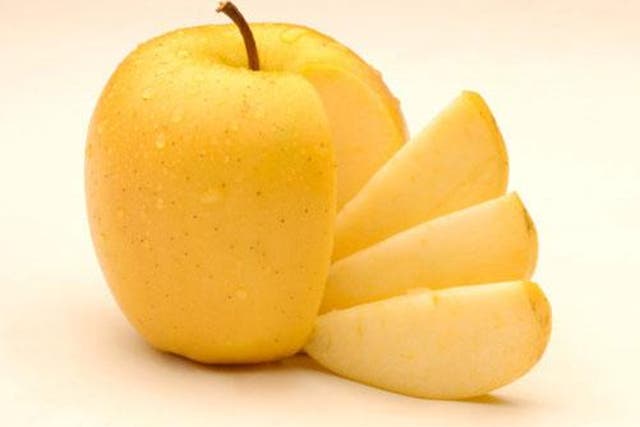 The genetically modified apple is scheduled to hit supermarket shelves as part of a 10-location trial next month