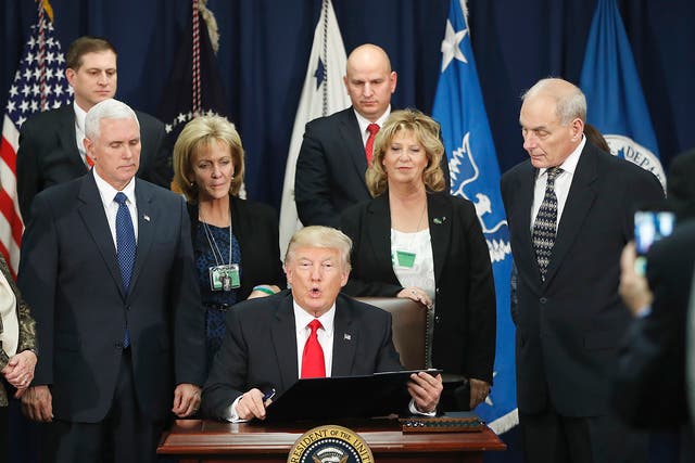President Donald Trump, accompanied by Vice President Mike Pence, Homeland Security Secretary John F. Kelly, and others, speaks during a visit to the Homeland Security Department in Washington