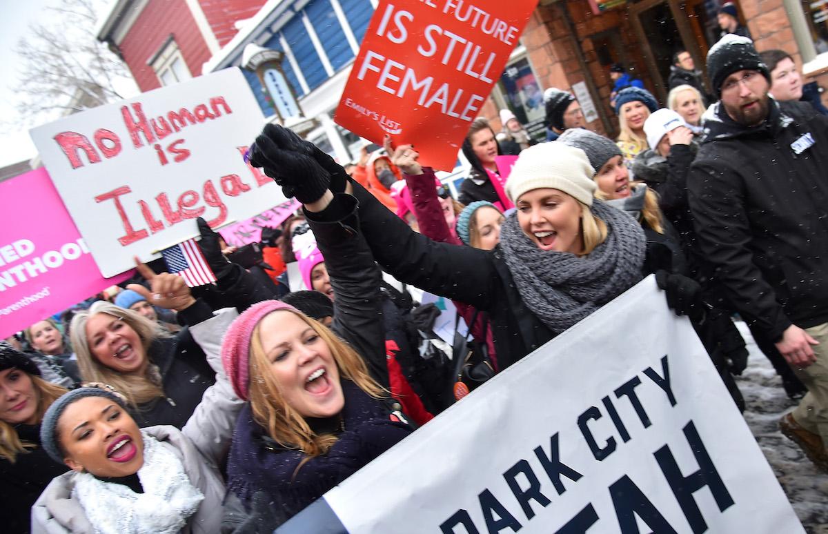Charlize Theron poses during the Women's March on Main Street Park City on January 21, 2017 in Park City, Utah.