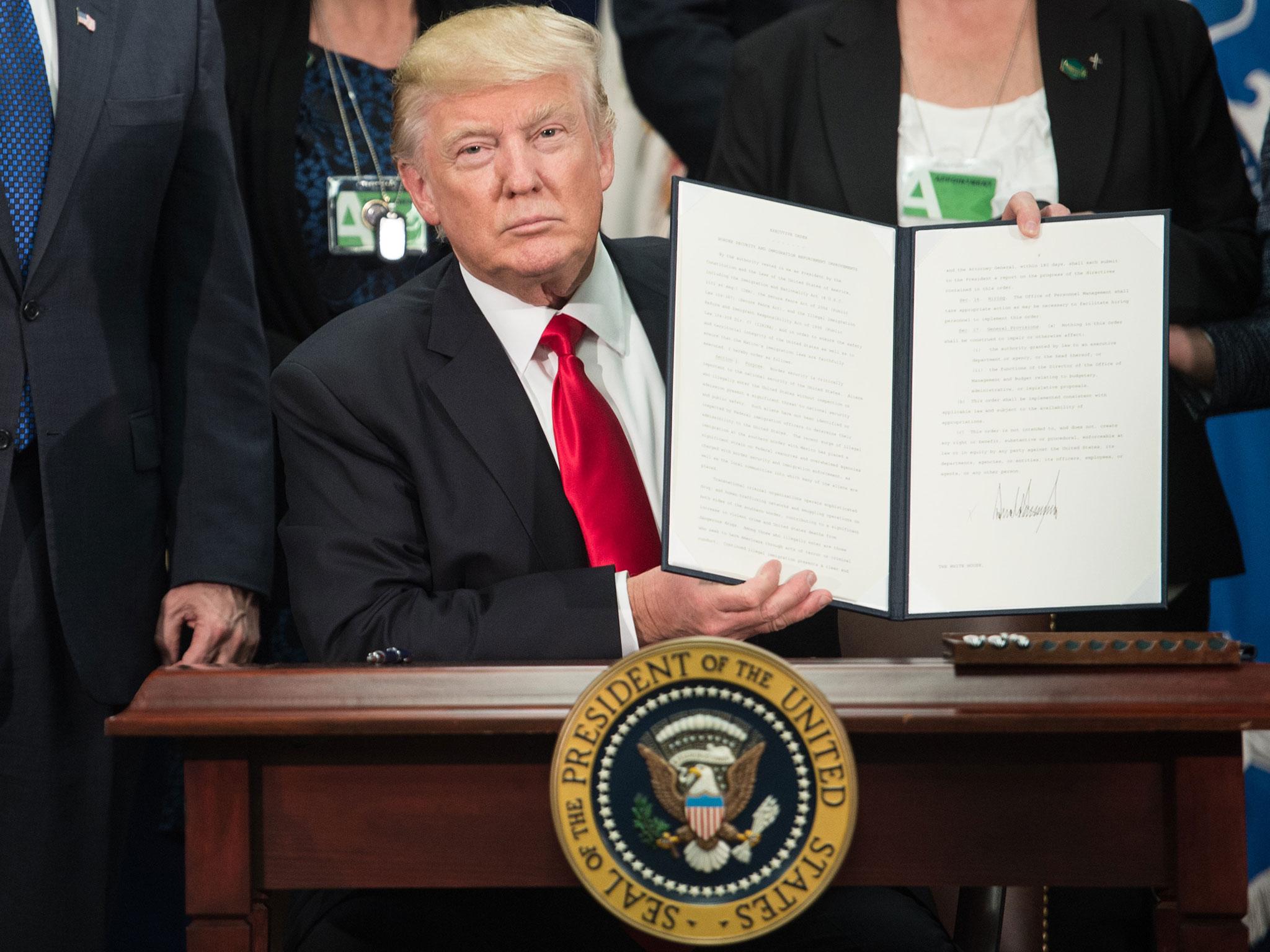 Donald Trump signs executive order to start Mexico border wall project