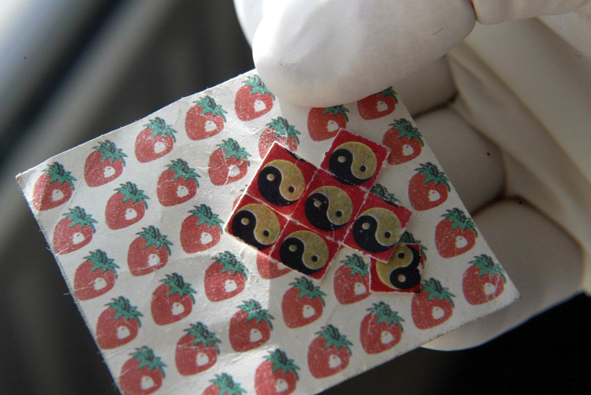 A sheet of LSD tabs – there have been mixed results in trials so far (P