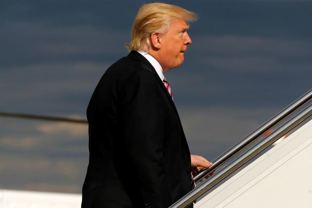 Donald Trump boards Air Force One for his first trip