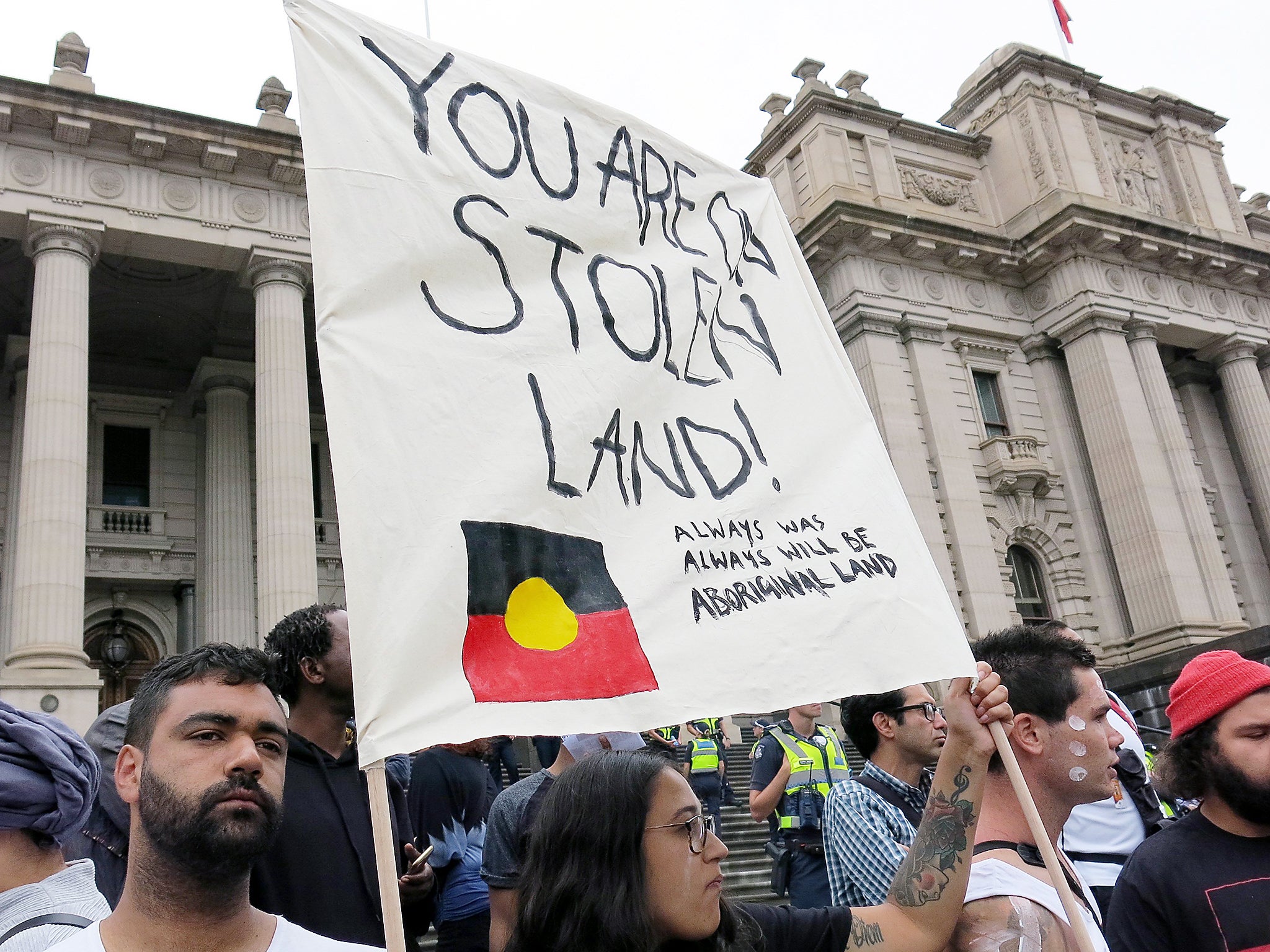 Indigenous activists march through Brisbane in an ‘Invasion Day’ protest
