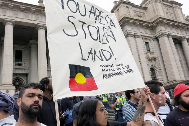 Indigenous activists march through Brisbane in an ‘Invasion Day’ protest