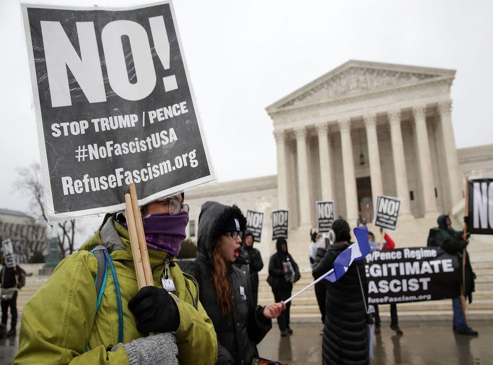 Activists stage an anti-Trump protest in front of the US Supreme Court, which no longer has representation on the White House website