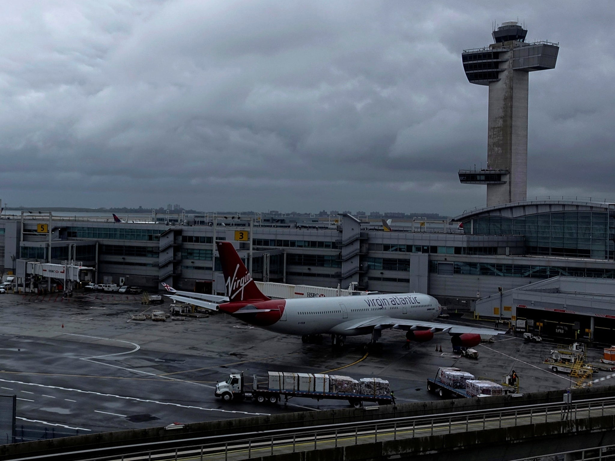 Flights between London and New York (pictured, JFK airport) could resume in time for Thanksgiving