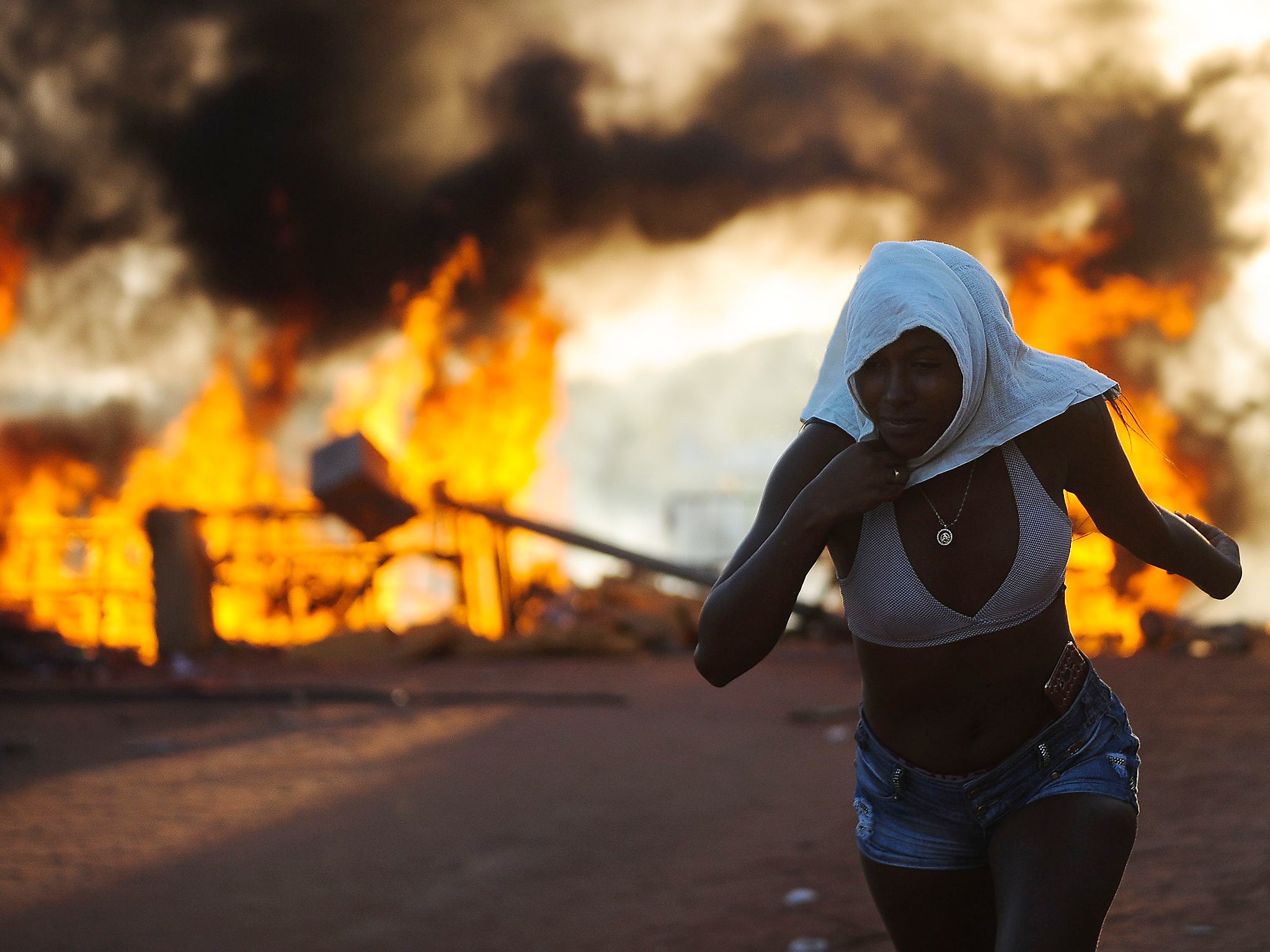 &#13;
Women relatives of inmates set makeshift barricades on fire in protest at the transfer of 200 prisoners from Alcacuz to other prisons in Rio Grande do Norte &#13;