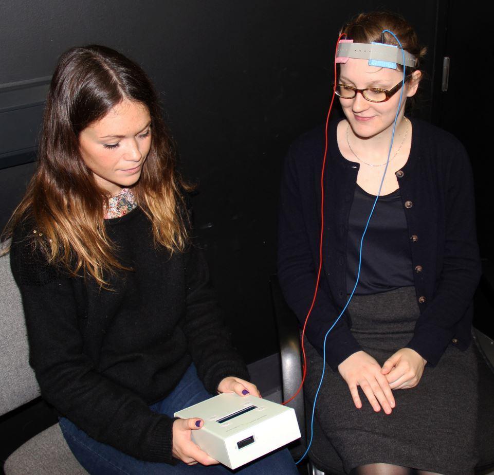 Dr Maria Kekic carrying out transcranial direct current stimulation on a volunteer