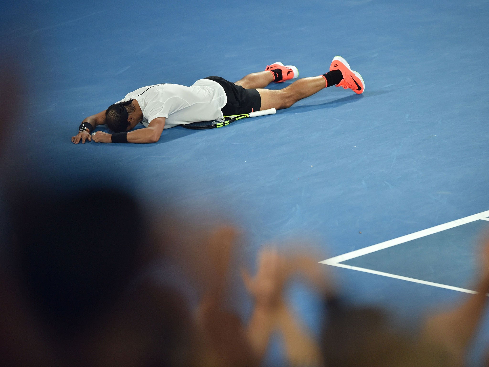 Nadal collapsed to the floor in delight after seeing off his opponent