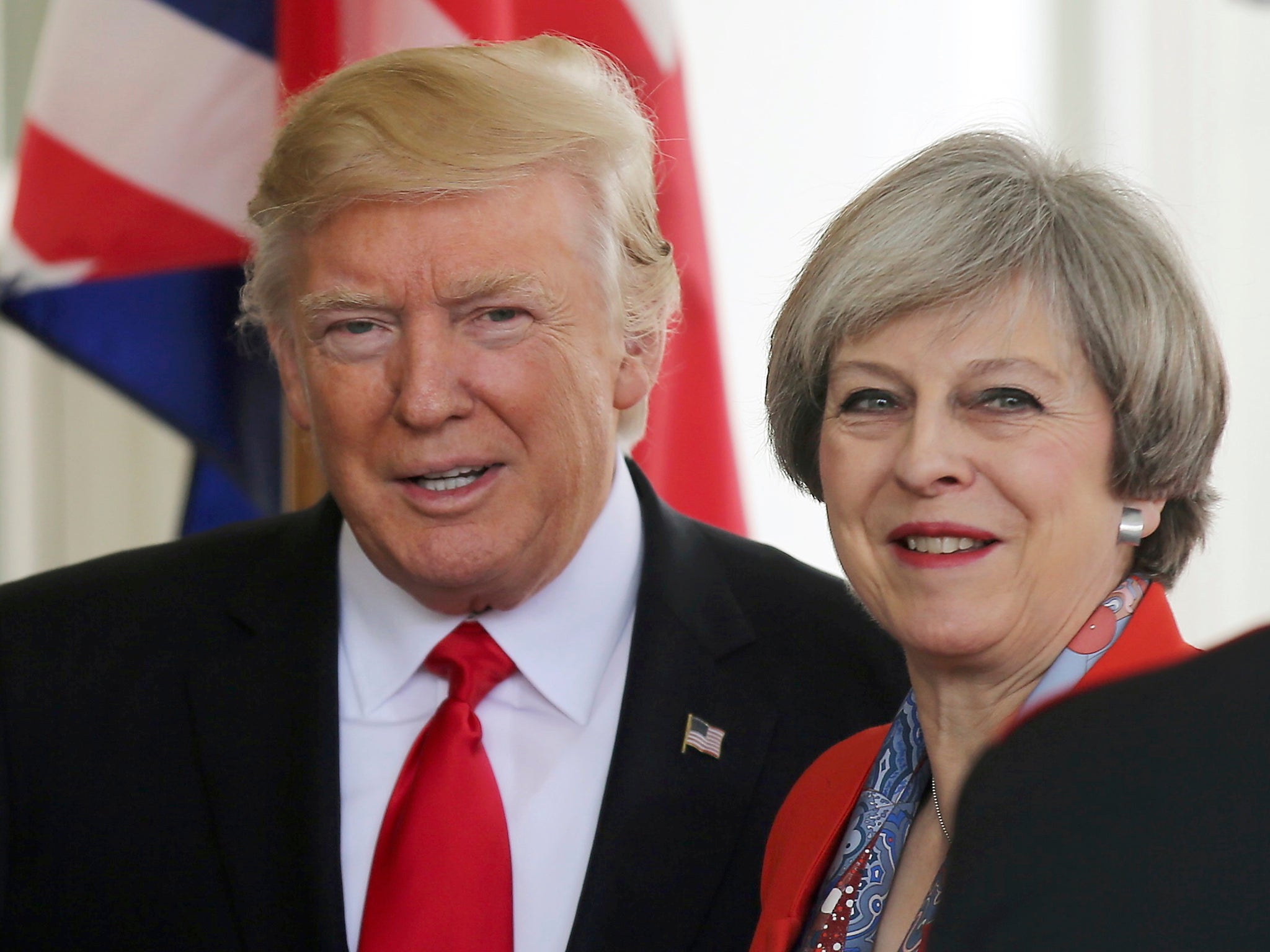 US President Donald Trump greets British Prime MinisterTheresa May as she arrives at the White House in Washington DC