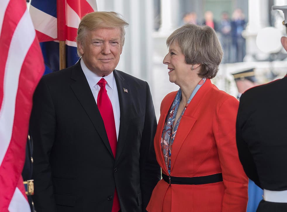 US President Donald J. Trump greets British Prime Minister Theresa May as she arrives at the White House in Washington DC