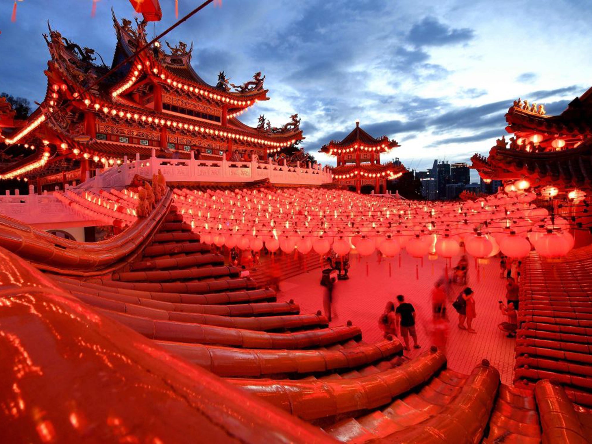 Devotees arrive to offer prayers at the Thean Hou temple in Kuala Lumpur on the eve of the lunar New Year