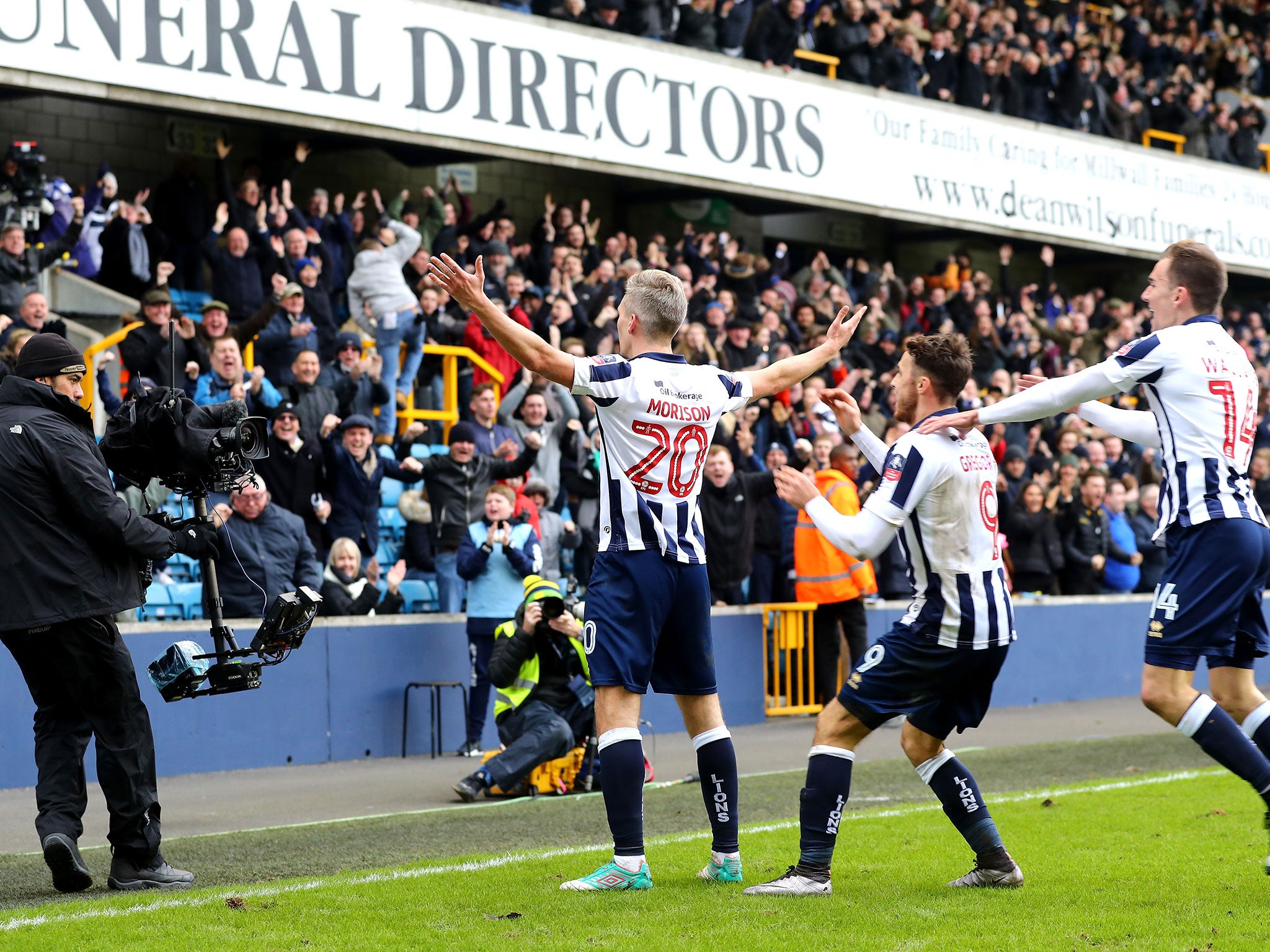 Steve Morison celebrates with fans after scoring his side's first goal