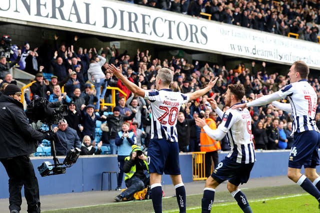 Steve Morison celebrates with fans after scoring his side's first goal