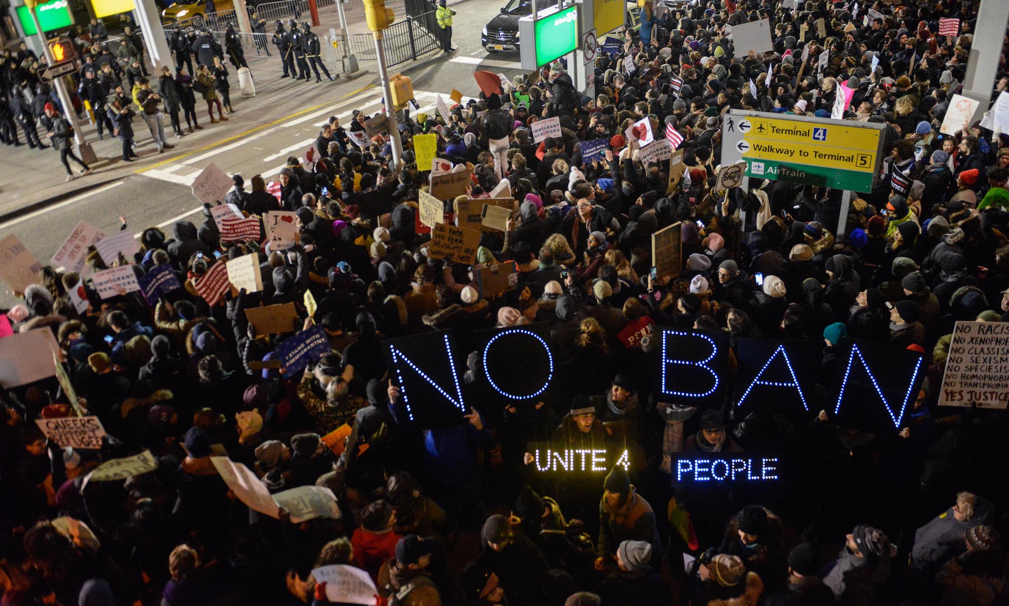 Protests outside Terminal 4 at JFK airport where two Iraqis were detained despite holding valid visas