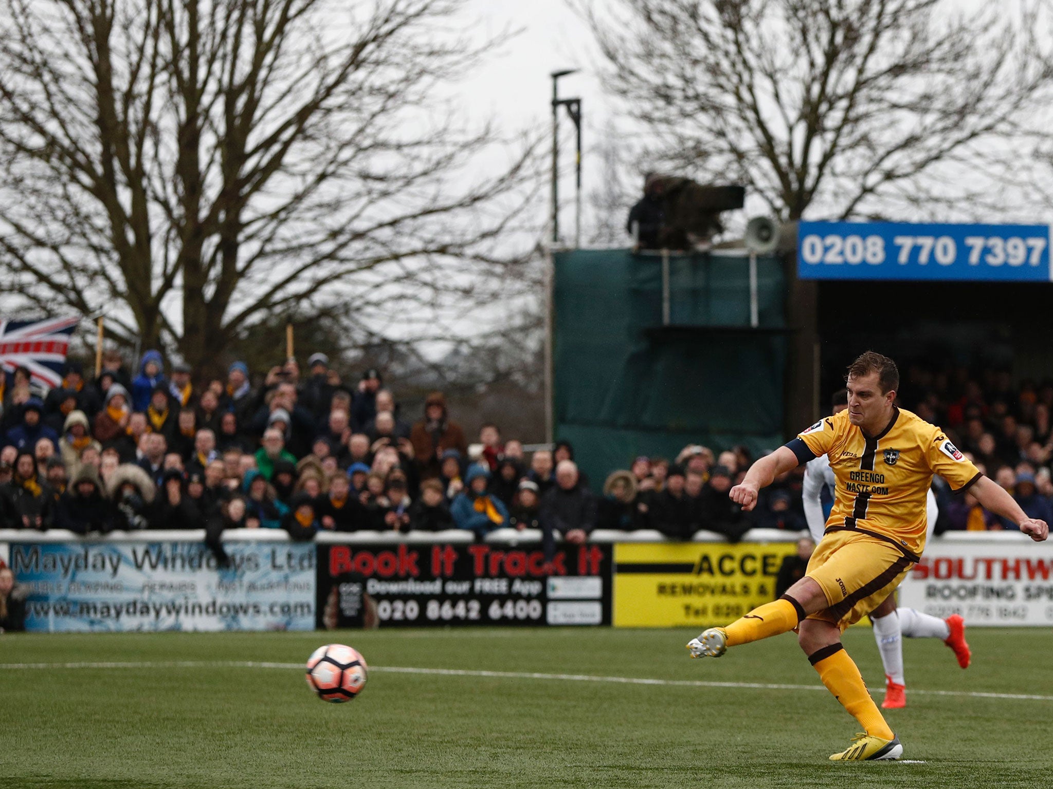 Jamie Collins converts from the spot for Sutton United