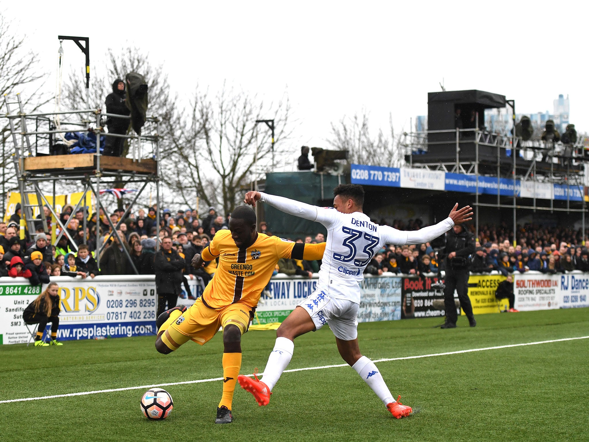 Kevin Amankwaah and Tyler Denton vie for the ball