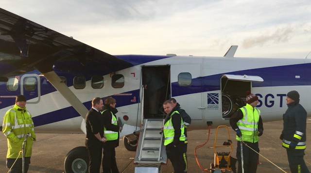 Check mates: staff working on the departure of the Loganair flight to Glasgow